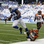 Indianapolis Colts tight end Dwayne Allen (83) makes a 32-yard touchdown reception against Cincinnati Bengals cornerback Dre Kirkpatrick (27) during the second half of an NFL football game Sunday, Oct. 19, 2014, in Indianapolis. (AP Photo/Michael Conroy)