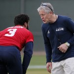 Seattle Seahawks' head coach Pete Carroll talks with quarterback Russell Wilson (3) during a team practice for NFL Super Bowl XLIX football game, Wednesday, Jan. 28, 2015, in Tempe, Ariz. The Seahawks play the New England Patriots in Super Bowl XLIX on Sunday, Feb. 1, 2015. (AP Photo/Matt York)
