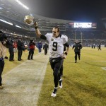 New Orleans Saints quarterback Drew Brees (9) celebrates as he leaves the field after an NFL football game against the Chicago Bears Monday, Dec. 15, 2014, in Chicago. The Saints won 31-15. (AP Photo/Charles Rex Arbogast)