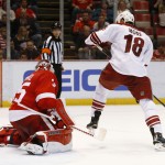 Arizona Coyotes right wing David Moss (18) redirects a shot to score against Detroit Red Wings goalie Jimmy Howard (35) during the third period of an NHL hockey game in Detroit Tuesday, March 24, 2015. Arizona won 5-4 in overtime. (AP Photo/Paul Sancya)