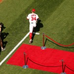 Washington Nationals left fielder Bryce Harper takes the field during an opening ceremony before a baseball game between the Washington Nationals and the New York Mets on opening day at Nationals Park, Monday, April 6, 2015, in Washington. (AP Photo/Andrew Harnik)