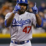 Los Angeles Dodgers' Howie Kendrick (47) gestures to his bench after hitting a stand up double against the Arizona Diamondbacks during the first inning of a baseball game, Tuesday, June 30, 2015, in Phoenix. (AP Photo/Matt York)