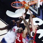 United States' Kenneth Faried, left, and Serbia's Nenad Krstic vie for the ball during the final World Basketball match between the United States and Serbia at the Palacio de los Deportes stadium in Madrid, Spain, Sunday, Sept. 14, 2014. (AP Photo/Manu Fernandez)