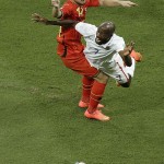 United States' DaMarcus Beasley is airborne after colliding with Belgium's Dries Mertens during the World Cup round of 16 soccer match between Belgium and the USA at the Arena Fonte Nova in Salvador, Brazil, Tuesday, July 1, 2014. (AP Photo/Themba Hadebe)