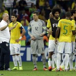  Brazil's coach Luiz Felipe Scolari, second left, stands with his players after the World Cup third-place soccer match between Brazil and the Netherlands at the Estadio Nacional in Brasilia, Brazil, Saturday, July 12, 2014. The Netherlands won the match 3-0. (AP Photo/Hassan Ammar)