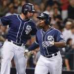 San Diego Padres' Justin Upton, right, celebrates with Yonder Alonso after Upton hit a two-run home run during the fifth inning against the Arizona Diamondbacks in a baseball game Saturday, June 27, 2015, in San Diego. (AP Photo/Lenny Ignelzi)
