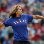 Former basketball player Nancy Lieberman throws out the first pitch before a baseball game between the Arizona Diamondbacks and Texas Rangers on Tuesday, July 7, 2015, in Arlington, Texas. (AP Photo/Tony Gutierrez