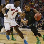 Oregon's Joseph Young (3) drives against Arizona's Stanley Johnson during the first half of an NCAA college basketball game in the championship of the Pac-12 conference tournament Saturday, March 14, 2015, in Las Vegas. (AP Photo/John Locher)