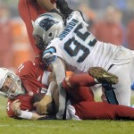 Arizona Cardinals' Ryan Lindley (14) is sacked by Carolina Panthers' Charles Johnson (95) in the second half of an NFL wild card playoff football game in Charlotte, N.C., Saturday, Jan. 3, 2015. The Panthers won 27-16. (AP Photo/Mike McCarn)