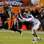 Oklahoma State wide receiver Brandon Sheperd can't hold on to the ball as Washington defensive back Sidney Jones (26) defends during the first half of the Cactus Bowl NCAA college football game, Friday, Jan. 2, 2015, in Tempe, Ariz. (AP Photo/Rick Scuteri)
