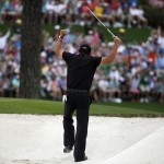 Phil Mickelson celebrates after hitting out of a bunker on the 15th hole during the fourth round of the Masters golf tournament Sunday, April 12, 2015, in Augusta, Ga. (AP Photo/Charlie Riedel)