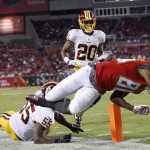 Tampa Bay Buccaneers wide receiver Solomon Patton (86) dives past Washington Redskins outside linebacker Adam Hayward (55) and cornerback Richard Crawford (20) to score on a 25-yard touchdown reception during the third quarter of an NFL preseason football game Thursday, Aug. 28, 2014, in Tampa, Fla. (AP Photo/Brian Blanco)