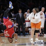Anthony Anderson dances with Yvonne, a member of the Timeless Torches, during the second half of the NBA All-Star celebrity basketball game Friday, Feb. 13, 2015, in New York. (AP Photo/Frank Franklin II)