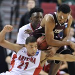 Texas Southern forward Malcolm Riley, right, battles for the ball with Arizona forward Brandon Ashley during the second half in the second round of the NCAA college basketball tournament in Portland, Ore., Thursday, March 19, 2015. Watching in the background is Arizona forward Stanley Johnson. (AP Photo/Greg Wahl-Stephens)