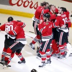Members of the Chicago Blackhawks celebrate after defeating the Tampa Bay Lightning in Game 6 of the NHL hockey Stanley Cup Final series on Monday, June 15, 2015, in Chicago. The Blackhawks defeated the Lightning 2-0 to win the series 4-2. (AP Photo/Charles Rex Arbogast)
