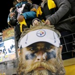 Pittsburgh Steelers fans hold a poster of Steelers defensive end Brett Keisel as the teams warm up before an NFL football game against the Baltimore Ravens, Sunday, Nov. 2, 2014, in Pittsburgh. (AP Photo/Gene Puskar)