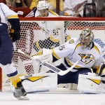Nashville Predators' Pekka Rinne (35), of Finland, makes a kick-save on a shot by the Arizona Coyotes as Predators' Paul Gaustad (28) and Roman Josi (59), of Switzerland, look on during the first period of an NHL hockey game Monday, March 9, 2015, in Glendale, Ariz. (AP Photo/Ross D. Franklin)
