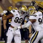 UCLA fullback Nate Iese (32) celebrates his touchdown with Eli Ankou (96) during the first half of an NCAA college football game against Arizona State, Thursday, Sept. 25, 2014, in Tempe, Ariz. (AP Photo/Rick Scuteri)