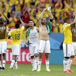 Colombian players celebrate after the group C World Cup soccer match between Colombia and Ivory Coast at the Estadio Nacional in Brasilia, Brazil, Thursday, June 19, 2014. Colombia won the match 2-1. (AP Photo/Marcio Jose Sanchez)