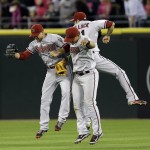  Arizona Diamondbacks outfielders A.J. Pollock, right, Cody Ross, left, and Gerardo Parra, center, celebrate after they defeated the Chicago White Sox 4-3 in an interleague baseball game in Chicago, Saturday, May 10, 2014. (AP Photo/Nam Y. Huh)