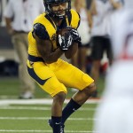 California wide receiver Bryce Treggs catches the ball on an 80-yard touchdown during the first half of an NCAA college football game against Arizona, Saturday, Sept. 20, 2014, in Tucson, Ariz. (AP Photo/Rick Scuteri)