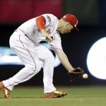 National League's Todd Frazier, of the Cincinnati Reds, cannot make a catch on a ball hit by American League's Alcides Escobar, of the Kansas City Royals, during the fifth inning of the MLB All-Star baseball game, Tuesday, July 14, 2015, in Cincinnati. (AP Photo/Jeff Roberson)
