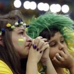 Brazil supporters react after the World Cup third-place soccer match between Brazil and the Netherlands at the Estadio Nacional in Brasilia, Brazil, Saturday, July 12, 2014. The Netherlands won the match 3-0. (AP Photo/Hassan Ammar)