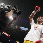 Manny Pacquiao, from the Philippines, acknowledges the crowd before the start of his world welterweight championship bout against Floyd Mayweather Jr., on Saturday, May 2, 2015 in Las Vegas. (AP Photo/John Locher)