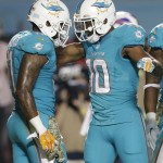 Miami Dolphins wide receivers Brandon Gibson (10) and Mike Wallace celebrate after Gibson scored a touchdown during the second half of an NFL football game against the Buffalo Bills, Thursday, Nov. 13, 2014 in Miami Gardens, Fla. (AP Photo/Lynne Sladky)