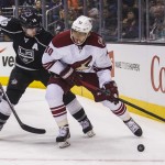  Los Angeles Kings forward Mike Richards (10) and Phoenix Coyotes forward Martin Erat (10) of Czech Republic, vie for the puck during the first period of an NHL hockey game, Wednesday, April 2, 2014, in Los Angeles. (AP Photo/Ringo H.W. Chiu)