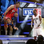 Nick Cannon, left, and Kevin Hart, right, dance as they are announced for the NBA All-Star celebrity basketball game Friday, Feb. 13, 2015, in New York. (AP Photo/Frank Franklin II)