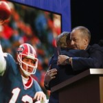 NFL Hall of Famer and Buffalo Bill Quarterback Jim Kelly hugs NFL commissioner Roger Goodell before he announces that the Buffalo Bills selects Florida State defensive back Ronald Darby as the 50th pick in the second round of the 2015 NFL Football Draft, Friday, May 1, 2015, in Chicago. (AP Photo/Charles Rex Arbogast)