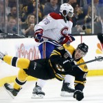  Boston Bruins right wing Reilly Smith (18) falls to the ice after crashing with Montreal Canadiens defenseman P.K. Subban (76) during the first period in Game 1 of an NHL hockey second-round playoff series in Boston, Thursday, May 1, 2014. (AP Photo/Elise Amendola)
