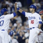 Los Angeles Dodgers' Andre Ethier celebrates his three run home run with Howie Kendrick, left, past Arizona Diamondbacks catcher Welington Castillo, right, after hitting in Kendrick and Yasmani Grandal, not pictured, during the fifth inning of a baseball game, Monday, June 8, 2015, in Los Angeles. (AP Photo/Danny Moloshok)