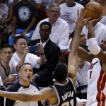 Miami Heat center Chris Bosh (1) prepares to shoot against San Antonio Spurs forward Tim Duncan (21) in the first half in Game 3 of the NBA basketball finals, Tuesday, June10, 2014, in Miami. (AP Photo/Lynne Sladky)