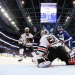 Chicago Blackhawks goalie Corey Crawford watches as Tampa Bay Lightning defenseman Jason Garrison's goal flies by during the third period in Game 2 of the NHL hockey Stanley Cup Final on Saturday, June 6, 2015, in Tampa Fla. (Bruce Bennett/Pool Photo via AP)