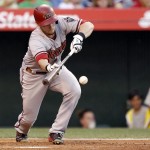 Arizona Diamondbacks' Chris Owings bunts for a single against the Los Angeles Angels during the second inning of a baseball game in Anaheim, Calif., Tuesday, June 16, 2015. (AP Photo/Alex Gallardo)
