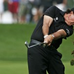 Phil Mickelson hits from the fairway on the 12th hole during the second round of the PGA Championship golf tournament at Valhalla Golf Club on Friday, Aug. 8, 2014, in Louisville, Ky. (AP Photo/Mike Groll)