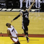 San Antonio Spurs guard Danny Green (4) goes to the basket as Miami Heat guard Dwyane Wade (3) looks on in the first half in Game 3 of the NBA basketball finals, Tuesday, June10, 2014, in Miami. (AP Photo/Lynne Sladky)
