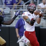 
Eastern Washington wide receiver Cory Mitchell, right, catches a 28-yard touchdown pass as Washington's Brandon Beaver defends in the first half of an NCAA football game Saturday, Sept. 6, 2014, in Seattle. (AP Photo/Elaine Thompson)