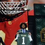 USC defensive lineman Leonard Williams poses for photos after being selected by the New York Jets as the sixth pick in the first round of the 2015 NFL Draft, Thursday, April 30, 2015, in Chicago. (AP Photo/Charles Rex Arbogast)