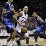 San Antonio Spurs' Manu Ginobili (20), of Argentina, is pressured by Dallas Mavericks' Brandan Wright (34) and Shawn Marion (0) during the first half of Game 2 of the opening-round NBA basketball playoff series on Wednesday, April 23, 2014, in San Antonio. (AP Photo/Eric Gay)