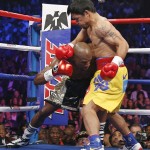 Floyd Mayweather Jr., left, and Manny Pacquiao, from the Philippines, trade punches in the corner during their welterweight title fight on Saturday, May 2, 2015 in Las Vegas. (AP Photo/John Locher)