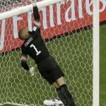 United States' goalkeeper Tim Howard deflects the ball over the crossbar during the World Cup round of 16 soccer match between Belgium and the USA at the Arena Fonte Nova in Salvador, Brazil, Tuesday, July 1, 2014. (AP Photo/Themba Hadebe)