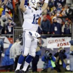 Indianapolis Colts quarterback Andrew Luck celebrates Zurlon Tipton's one-yard touchdown run during the first half of the NFL football AFC Championship game against the New England Patriots Sunday, Jan. 18, 2015, in Foxborough, Mass. (AP Photo/Matt Slocum)