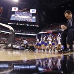 Duke head coach Mike Krzyzewski sits on the court during the second half of the NCAA Final Four college basketball tournament championship game against Wisconsin Monday, April 6, 2015, in Indianapolis. (AP Photo/David J. Phillip)