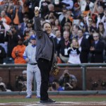 Comedian Billy Crystal holds up the ball after catching the ceremonial first pitch before Game 5 of baseball's World Series between the Kansas City Royals and the San Francisco Giants Sunday, Oct. 26, 2014, in San Francisco. (AP Photo/Matt Slocum)