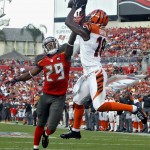 Cincinnati Bengals wide receiver A.J. Green (18) pulls in a 13-yard touchdown reception in front of Tampa Bay Buccaneers cornerback Leonard Johnson (29) during the third quarter of an NFL football game Sunday, Nov. 30, 2014, in Tampa, Fla. (AP Photo/Brian Blanco)