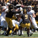 Missouri's Josh Augusta, center, pulls down an interception in a crowd of players during the third quarter of an NCAA college football game against Central Florida, Saturday, Sept. 13, 2014, in Columbia, Mo. (AP Photo/L.G. Patterson)