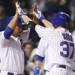  Chicago Cubs' Travis Wood, right, celebrates with Welington Castillo after Wood hit a three-run home run against the Arizona Diamondbacks during the second inning of a baseball game on Monday, April 21, 2014, in Chicago. Castillo scored on the home run. (AP Photo/Andrew A. Nelles)